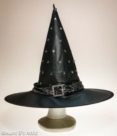 Dressy jeweled witch hat, is in a black poly, that has almost a satin shine to it. Trimmed with a silver spider web design band, and accented with a rhinestone buckle. Includes an extra pack of jewels. 5" wired brim, 14 1/2" crown. Very pretty! Halloween Costume Hats, Spider Web Design, Costume Hats, Witch Hat, Halloween Art, Spider Web, Halloween Costume, Halloween Costumes, Witch