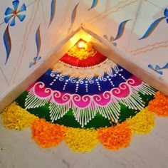 a decorated floor with flowers and candles on it