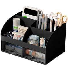 a black desk organizer with scissors and other office supplies