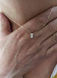 This is a beautiful diamond design pendant with 2 Diamonds. It is set in real solid 14Kt Gold and the chain is 14Kt Gold as well. You can choose if you want 14Kt White Gold, 14Kt Yellow Gold or 14Kt Rose Gold. This is the perfect gift for mom, wife, fiancee, girlfriend, valentine, daughter, family or friend. It is a special gift for mother's day, valentine's day, wedding, anniversary, birthday, Christmas, Easter, New Year's and any holiday. Each diamond is 0.15 Carats Total is 0.30 Carats Color: Cheap Gold Jewelry With Sparkling Stones, Two Diamond Necklace, Diamond Necklace Bridal, Diamond Gold Necklace, خواتم خطوبة, Real Diamond Necklace, Dainty Diamond Necklace, Round Two, Necklace For Her