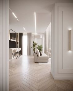 a living room filled with furniture and white walls