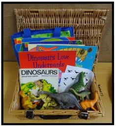 a wicker basket filled with books and toys