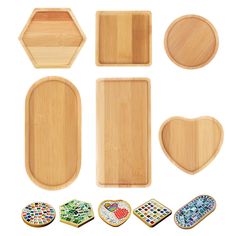 wooden trays with different shapes and designs on them, including one shaped like a heart