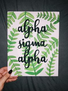 a person holding up a card with the words aloha signa aloha on it