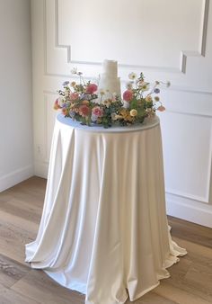 a wedding cake on top of a white table