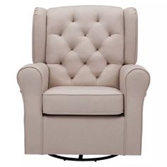 the beige chair is upholstered with buttons on it's armrests