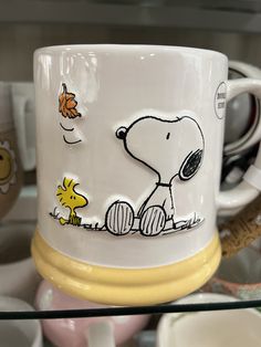 there is a coffee cup with a drawing on it