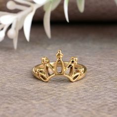 a gold crown ring sitting on top of a table