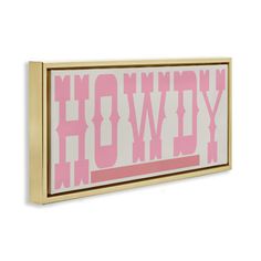 a pink and white framed sign with the word hollywood on it's front side