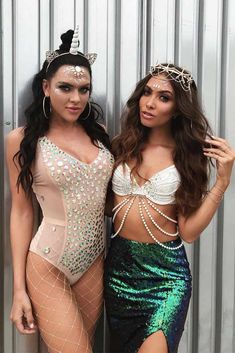 two women in bodysuits posing for the camera with one wearing a tiara