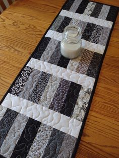 a table runner with a jar on it