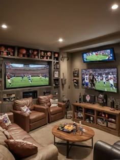 a living room filled with furniture and two large tvs mounted to the side of a wall