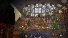 the inside of a library with lots of bookshelves and stairs leading up to it