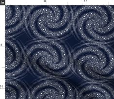 an image of a blue and white fabric with swirls on the side, as well as