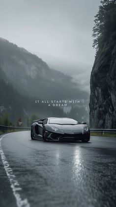 a black and white photo of a sports car driving down a wet road with the words it all starts with a dream