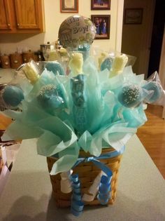 a basket filled with lots of blue and white items on top of a countertop