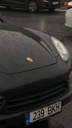 a black sports car is parked on the street