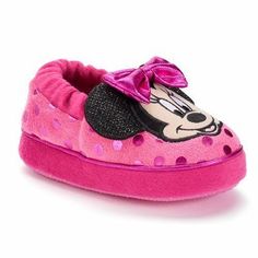 minnie mouse slippers with pink and black polka dots on the bottom, one shoe has a bow at the top