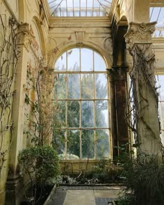 an old building with ivy growing on the walls and windows above it is instagramted