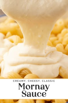 creamy cheese sauce being poured over macaroni and cheese