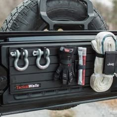 the back end of a truck with tools in it