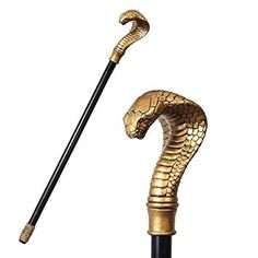 a gold colored snake head umbrella on a black pole with a long handle and an extended top