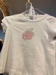 Brandy Melville Pink Sweater, Brandy Melville Cherub Top, Kewpie Brandy Melville, Brandy Melville Kewpie, Brandy Graphic Tees, Coquette Graphic Tee, Brandy Melville Baby Tee, Brandy Melville Cherub, Baby Tees Aesthetic