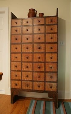 an old wooden dresser with many drawers