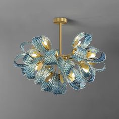 a blue and gold chandelier hanging from the ceiling