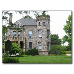 an old stone house with lots of windows