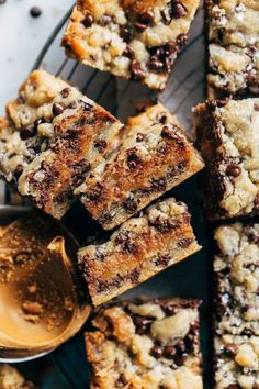 chocolate chip cookie bars on a cooling rack with a spoon