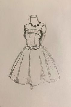 a drawing of a dress with a necklace on it's neck and belt around the waist