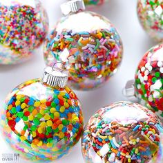 several glass ornaments with sprinkles on them