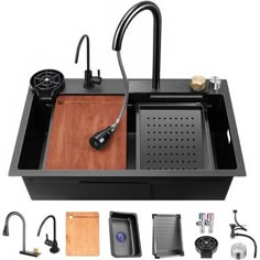 the kitchen sink is black and has various accessories