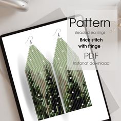 an image of a pair of green earrings on top of a white table with text overlay