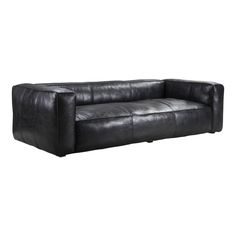 a black leather couch sitting on top of a white floor