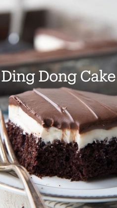 a piece of chocolate cake on a plate with the words ding dong cake above it