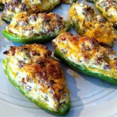 several stuffed peppers on a white plate