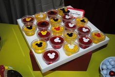 mickey mouse cupcakes are arranged on a tray