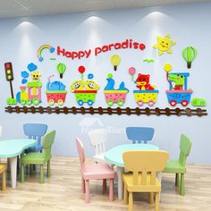 children's tables and chairs are arranged in front of a wall that says happy paradise