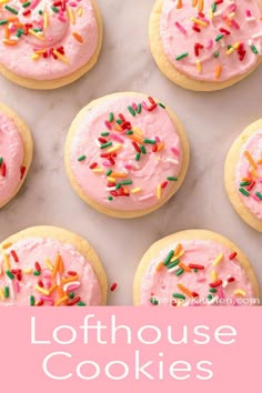 pink frosted cookies with sprinkles on top and the words, lofthouse cookies