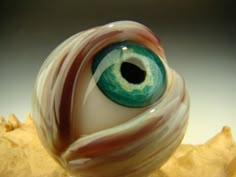 an eyeball is sitting on top of a table