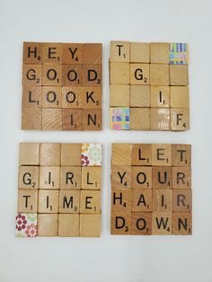 four scrabble tiles with words that spell out the word hey good look in