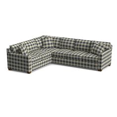 a large checkered couch sitting on top of a white floor