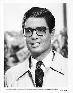 an old black and white photo of a man wearing glasses with the word collect written on his forehead