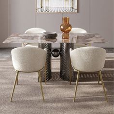 a dining room table with chairs and a vase on it's centerpiece in front of a window