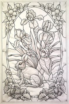 a stained glass window with flowers and rabbits