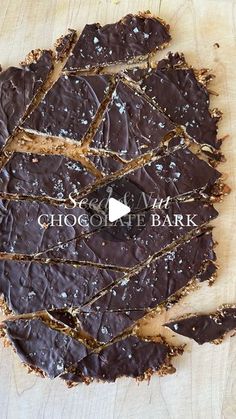 chocolate bark is cut into pieces on a cutting board with the words chocolate bark written in white