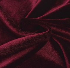 a close up view of a red velvet fabric