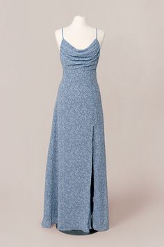 a blue dress on a mannequin head stand